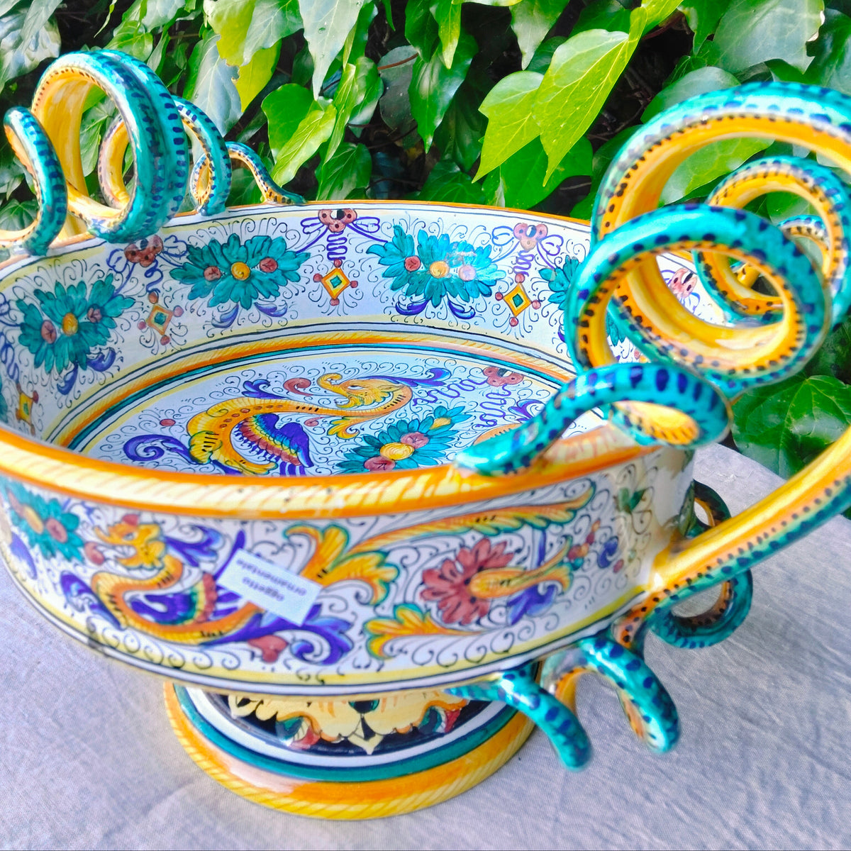 Stunning hand-painted Deruta ceramic centerpiece bowl with serpentine handles. Authentic Raffaellesco style, handmade in Italy.