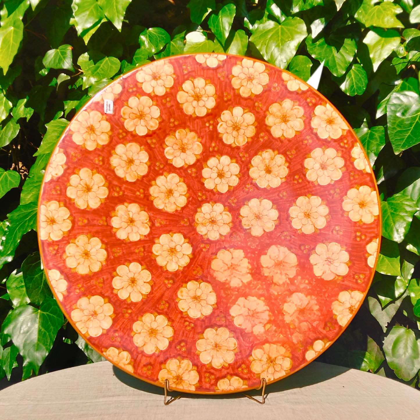 Large hand-painted Deruta ceramic decorative plate Ø 61 cm, rich red floral motif, signed by artist Michela. Authentic Italian artisan pottery, perfect as wall art or centerpiece.